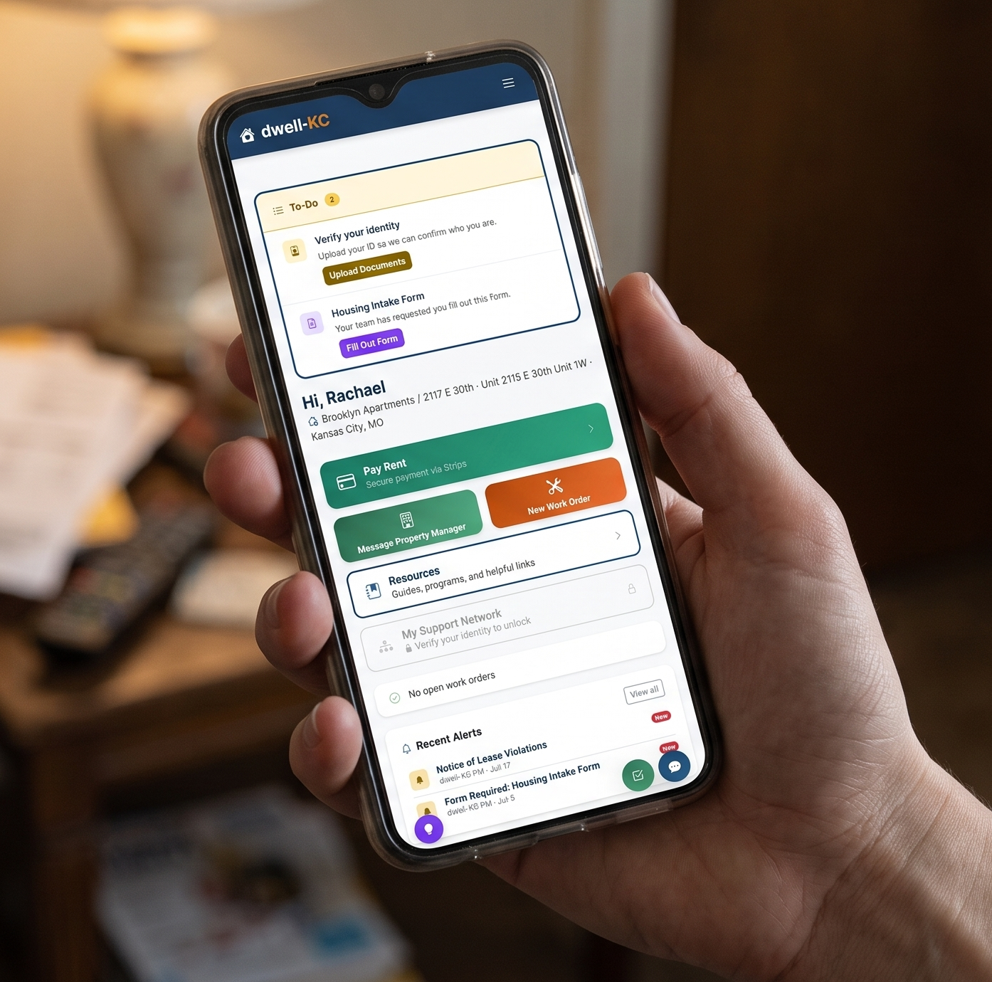 Client using the dWell-KC tenant portal on a phone